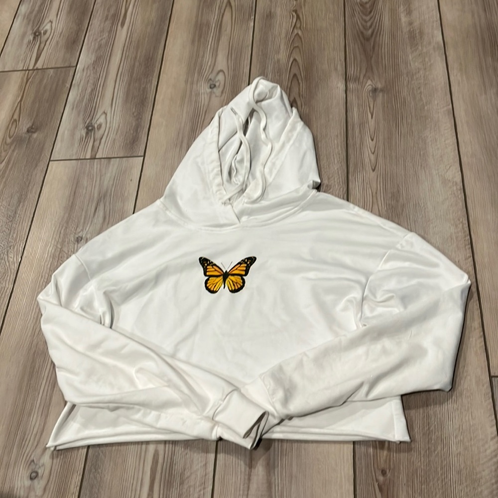 white cropped hoodie w/ orange butterfly